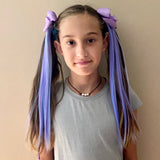 Girl Wearing Two Kids Blue & Purple Hair Extensions with Purple Bow as Pigtails