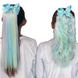 Girls wearing Mini Unicorn colorful hair extensions curly and straight. pink, purple, green and yellow