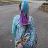 Girl Wearing Turquoise, White & Magenta Ponytail Hair Extensions & Matching Backpack