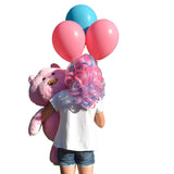 Girl wearing hair extensions hto match balloons and a teddy bear