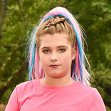 Front view of girl wearing pink and teal  hair extensions 