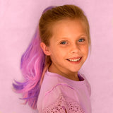 Girl wearing purple and pink clip on hair extension ponytail