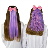 Girls wearing straight & wavy purple & pink hair extensions with bubble gum bow