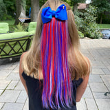 Girl wearing colorful red, white blue cute hair extension with bow