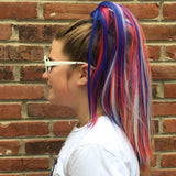 Girl wearing fun red white and blue colored hair accessory
