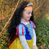 Little girl wearing Snow White Princess costume with Black Princess Hair