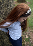 Girl wearing kids brown hair wig with tiara 