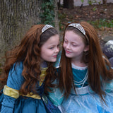Two girls wearing straight and curly brown princess extensions